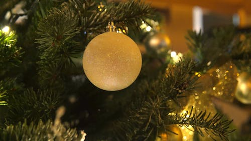 Close-Up Video of a Christmas Tree with Ornaments and Lights