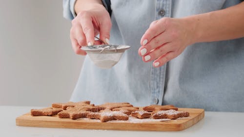 Putting Powdered Sugar on Cookies