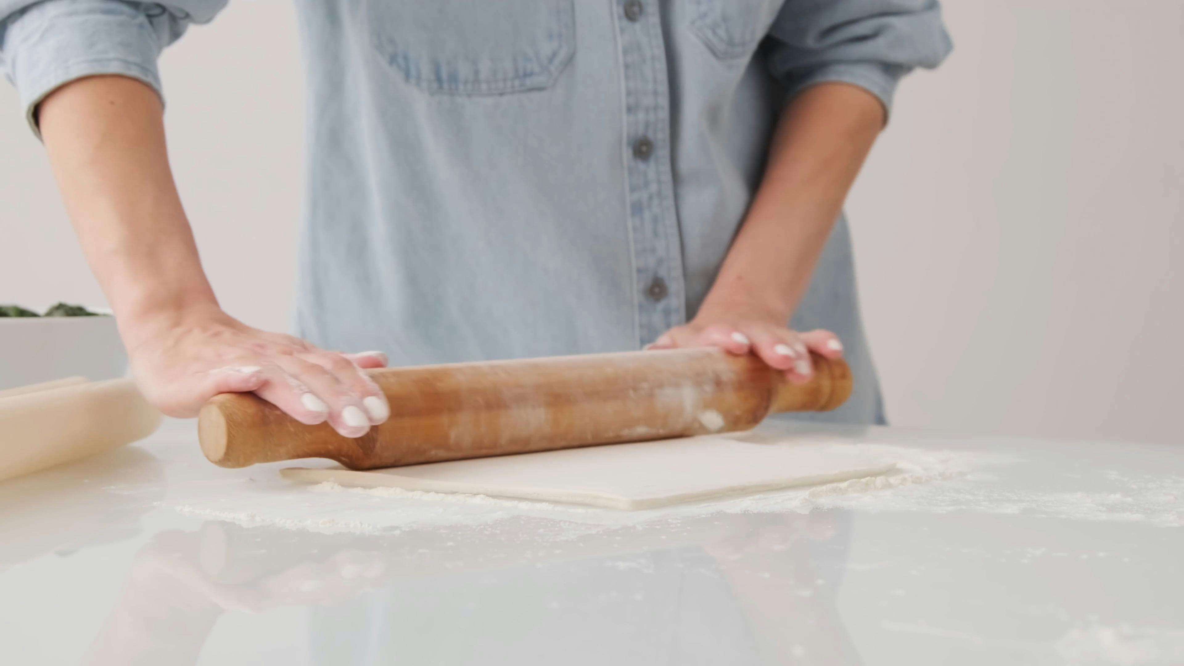 Using Rolling Pin To Flatten The Dough · Free Stock Video