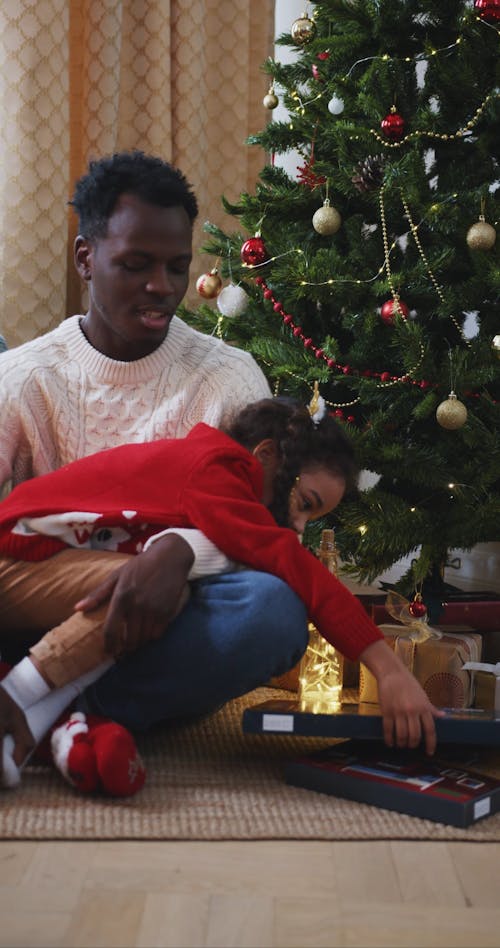 Dad and Daughter Playing an Advent Calendar Game