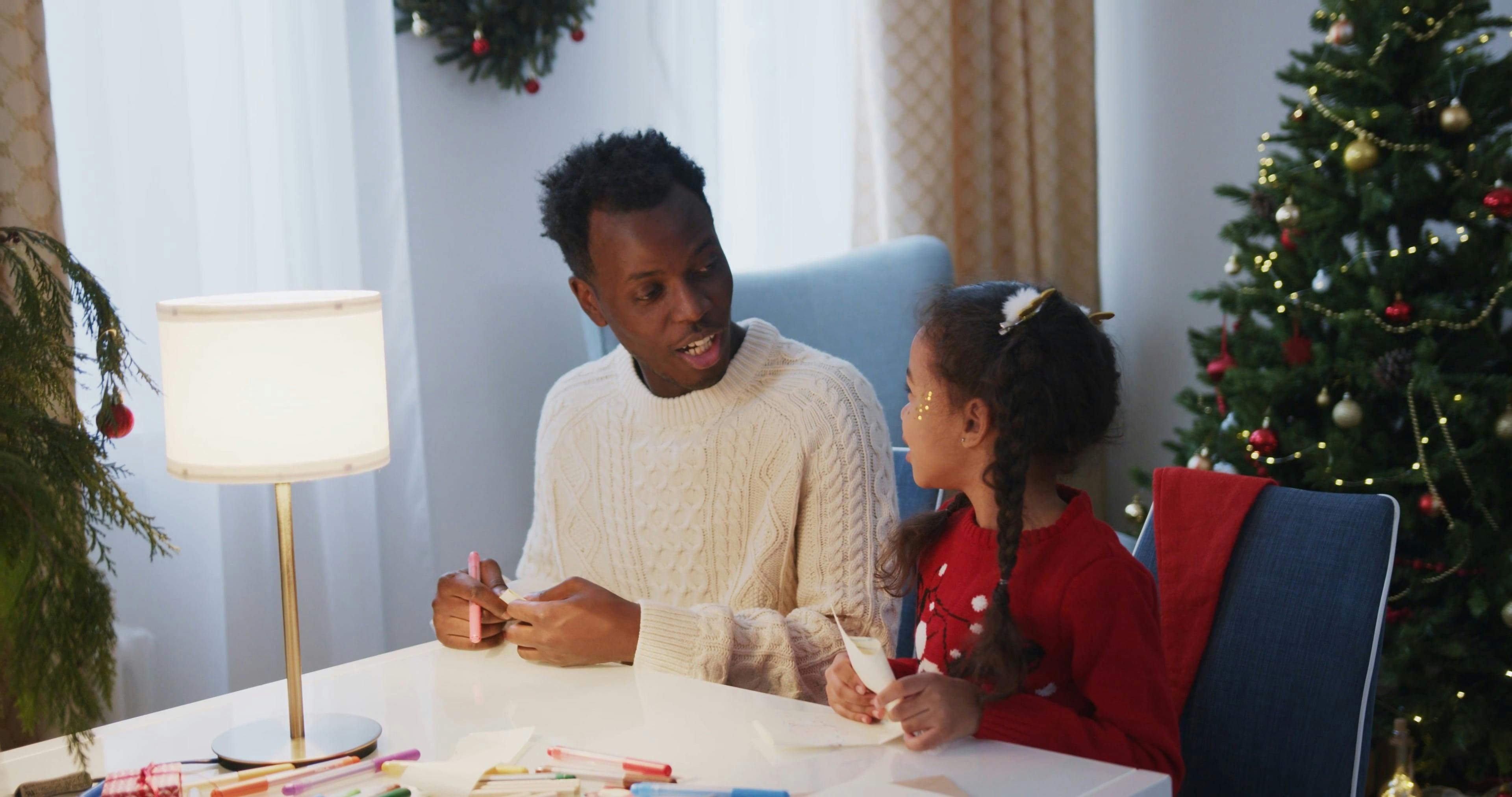 A Father And Daughter Putting Their Letters In An Envelope · Free Stock ...