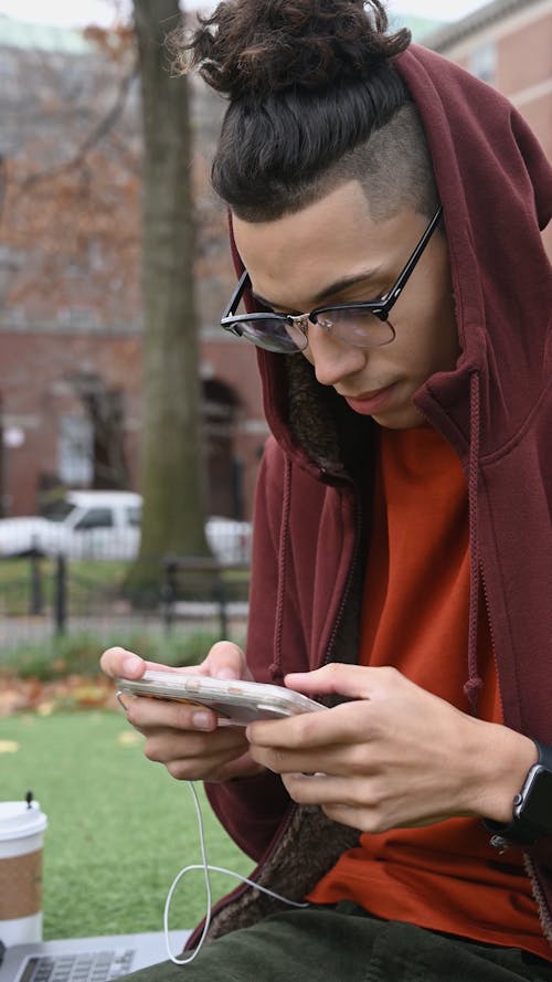 Young Person Playing Mobile Games