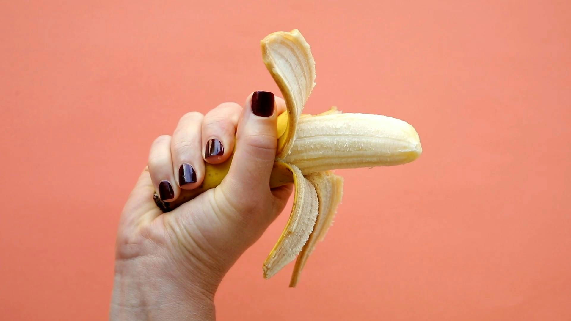 A Person Squeezing a Banana Free Stock Video Footage, Royalty-Free 4K