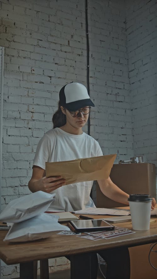 A Young Woman Working at an Office of a Shipping Company