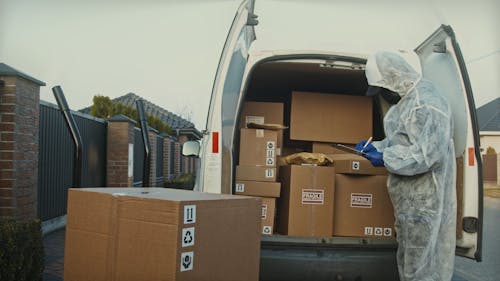 Delivery Worker Wearing Protective Clothes