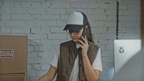 Female Worker Checking on Delivery Boxes