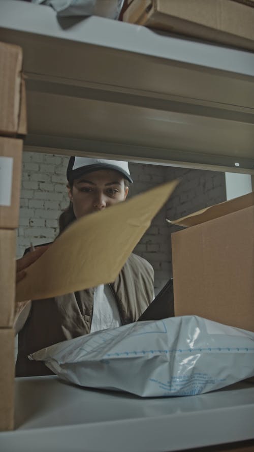 Worker Checking on Delivery Boxes