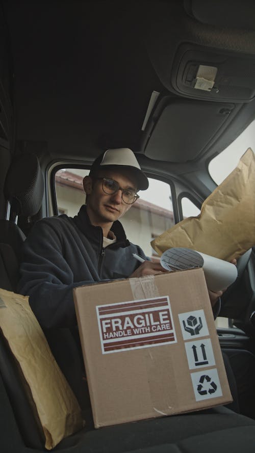 Person Inside a Car Delivering Packages