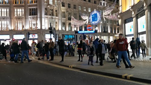 People Visiting Piccadilly Circus at Night 