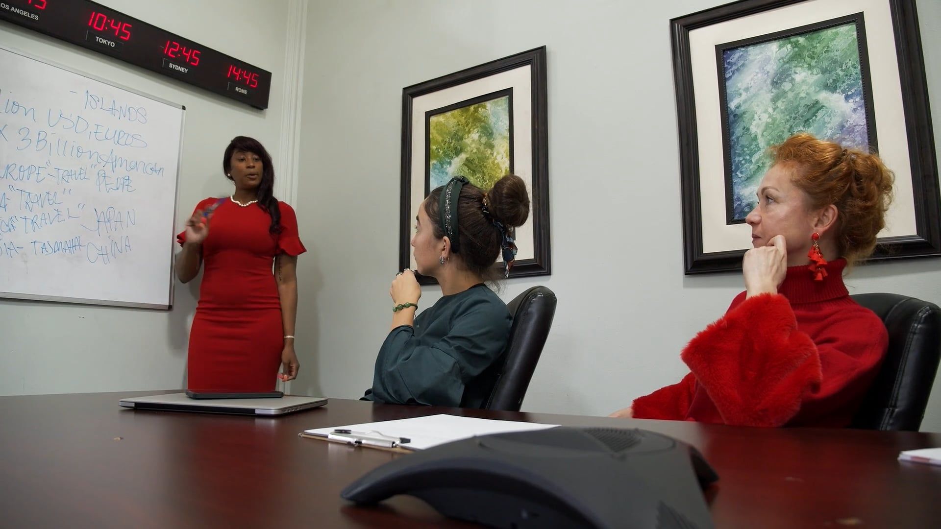 A woman in red is giving a presentation to a group of people Free Stock ...