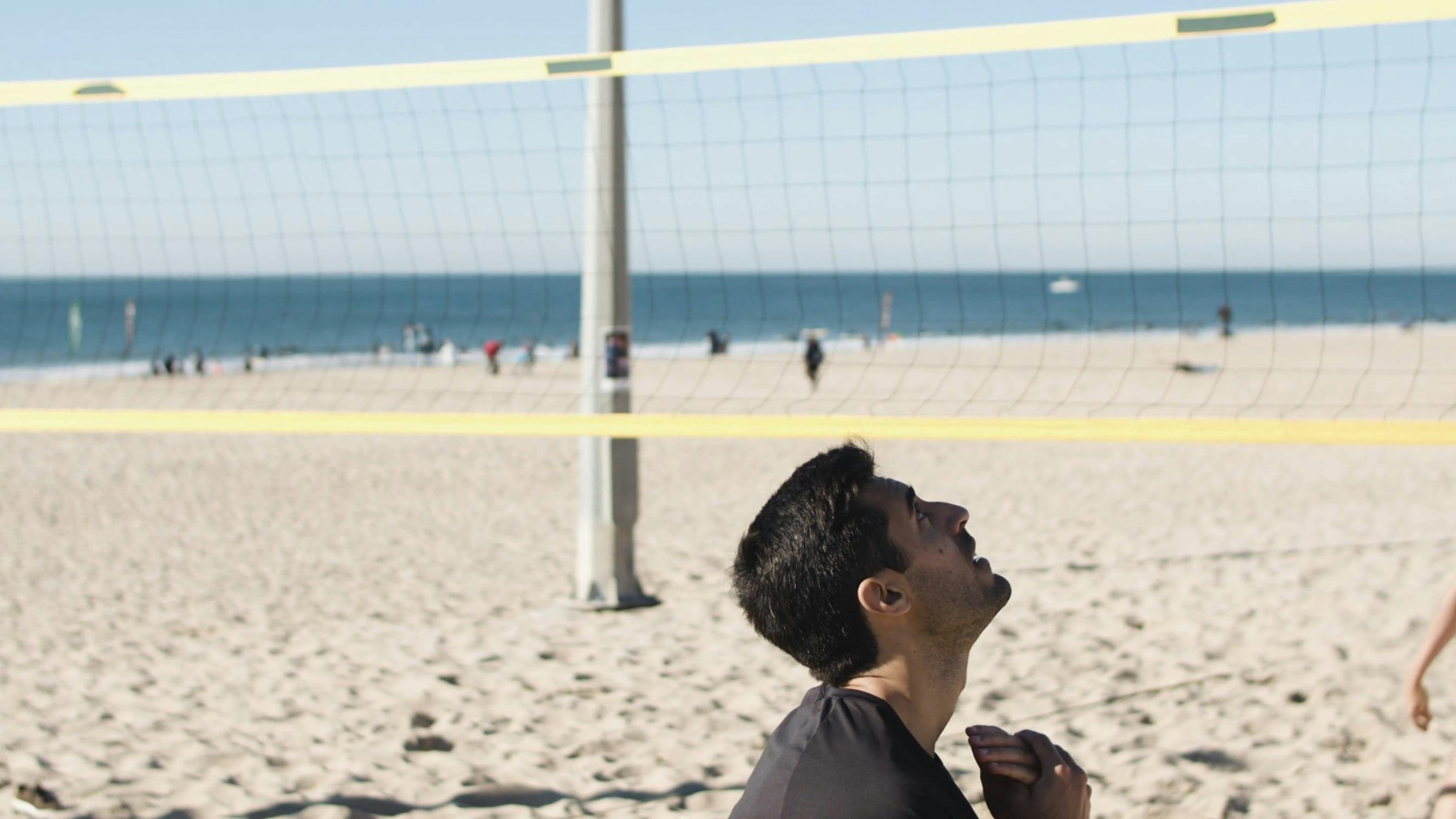 A Male and Female Playing volleyball · Free Stock Video