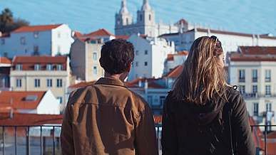 couple walking together while looking around