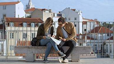 a couple sitting while looking at the map