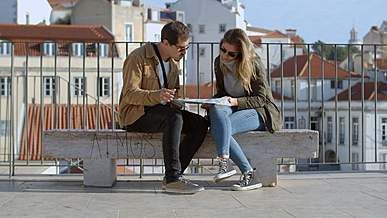 man and woman checking map