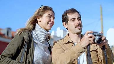 a man taking pictures using vintage camera