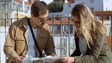 couple of tourists looking to map