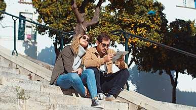 couple sitting on concrete stairs