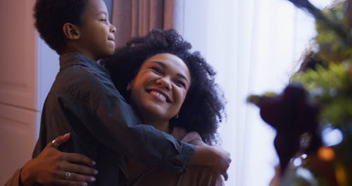 Kids Hugging Their Mom