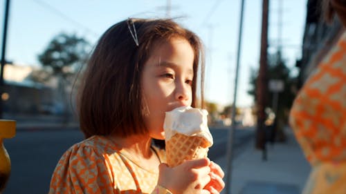 Cute Girl Eating Ice Cream