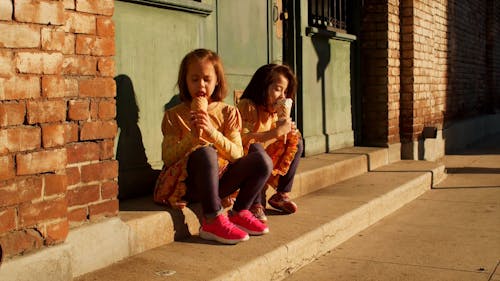 Young Girls Eating Ice Cream Together