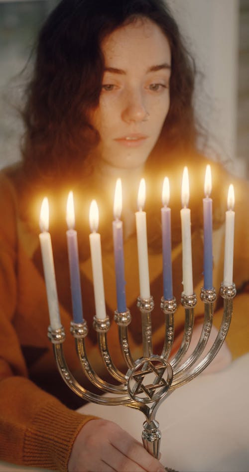 Girl Looking at a Menorah