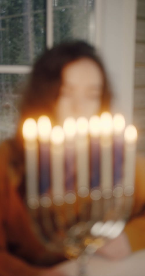 Woman Looking at the Candle Lights