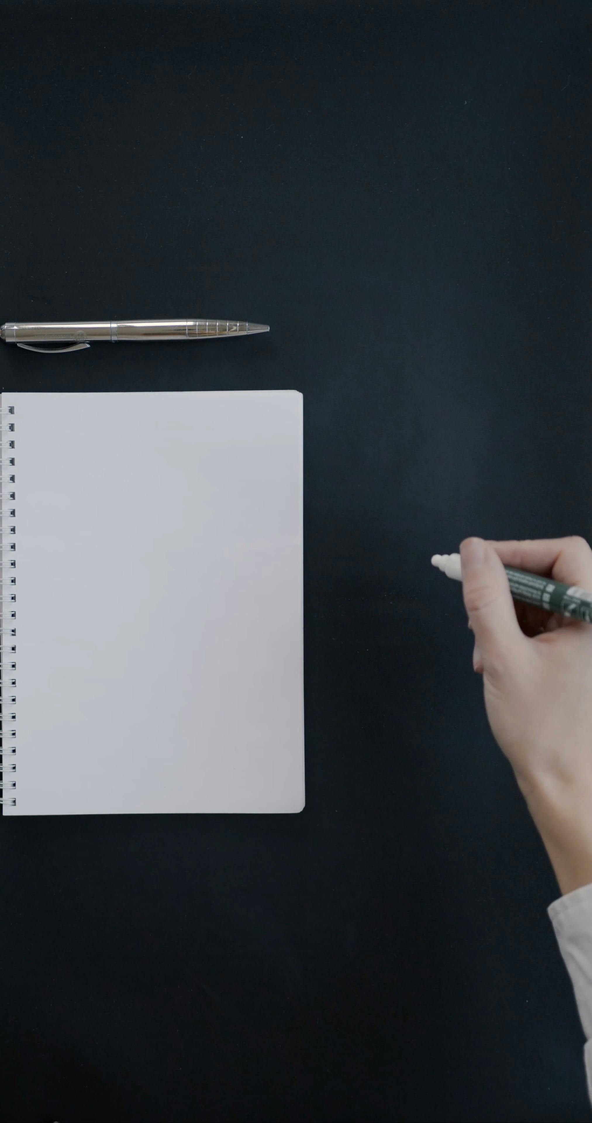 Person Writing in the Notepad · Free Stock Video