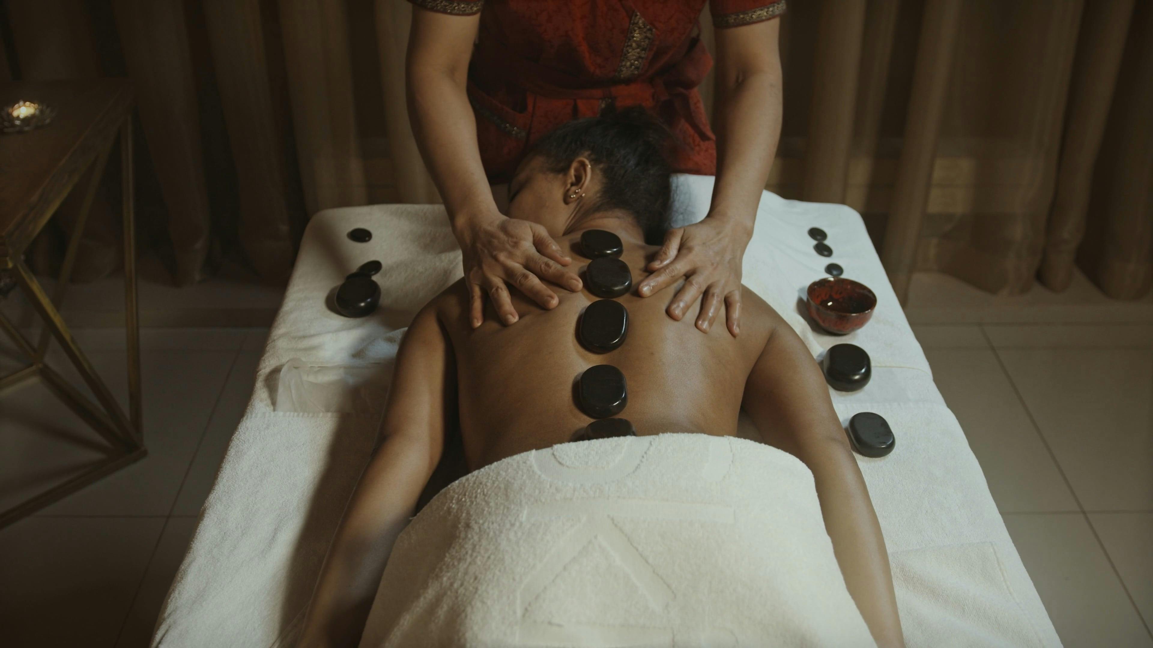 Woman Receiving Hot Stone Massage Therapy Free Stock Video Footage,  Royalty-Free 4K & HD Video Clip