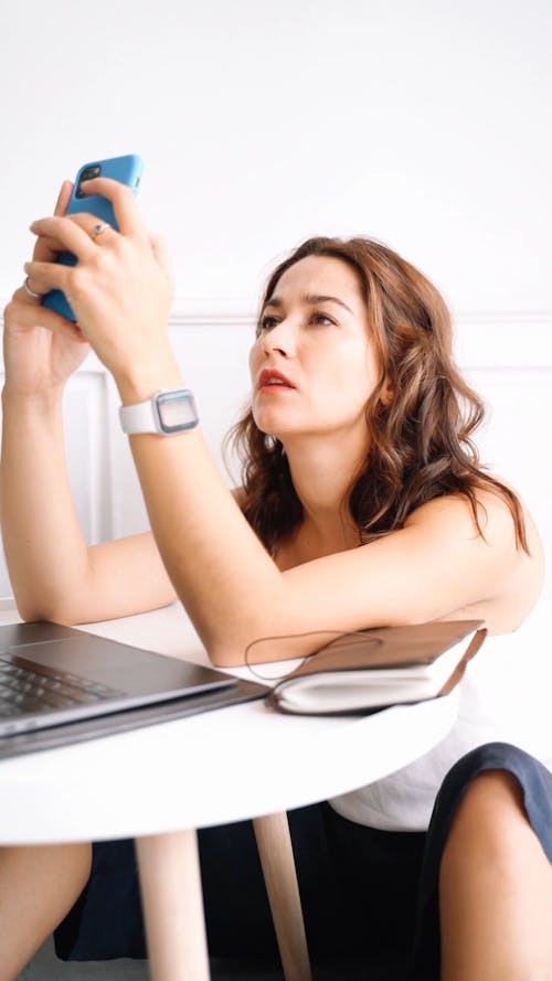 a Stressed Woman Using Cellphone