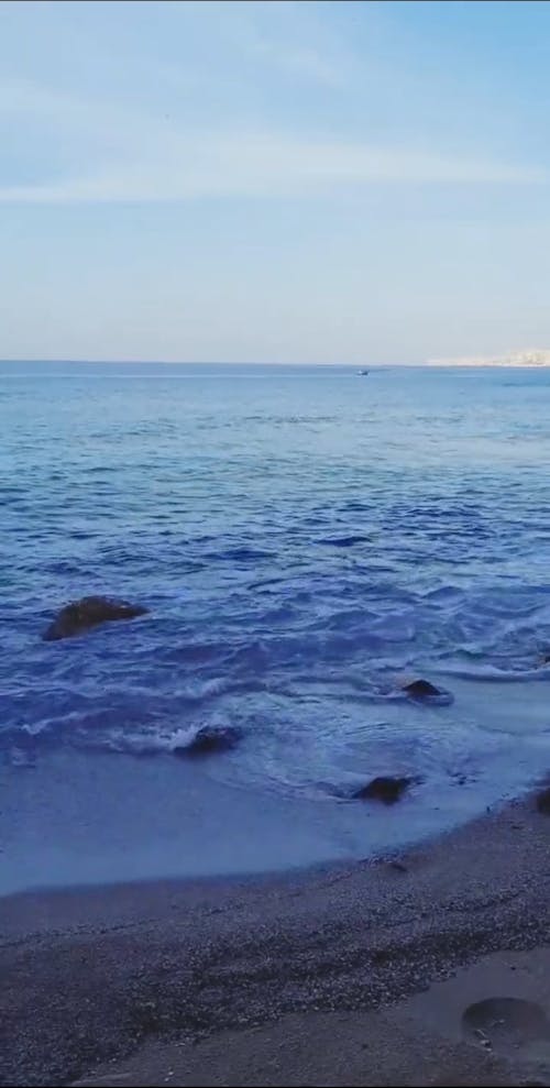 Close-up Video of the Sea Waves Hitting the Beach