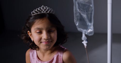 Little Girl With Dextrose Dancing Indoors