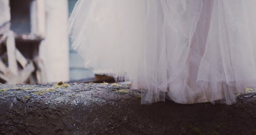 A Footage of a Bride and Groom's Legs