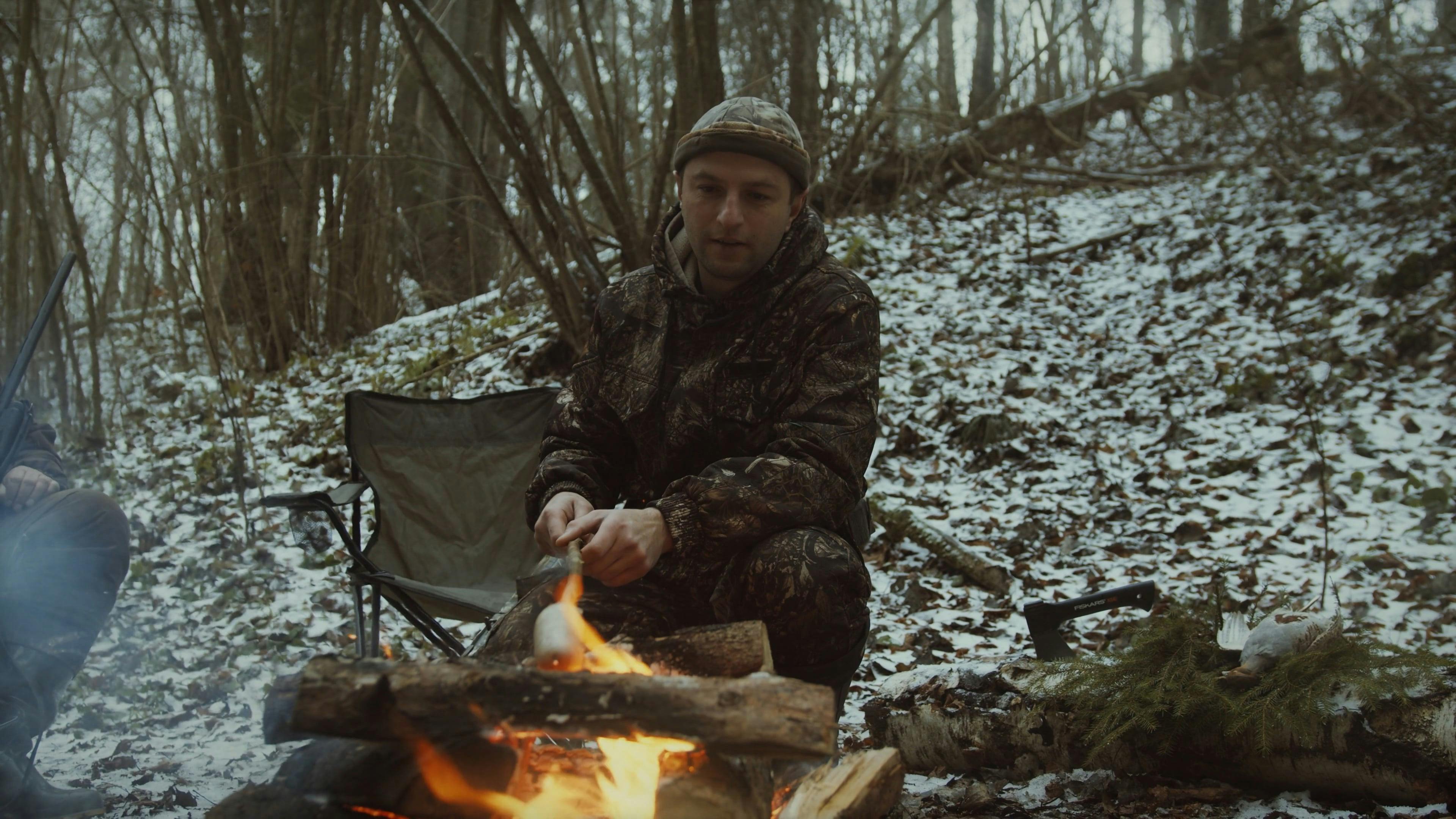 A Man Grilling on a Bonfire · Free Stock Video