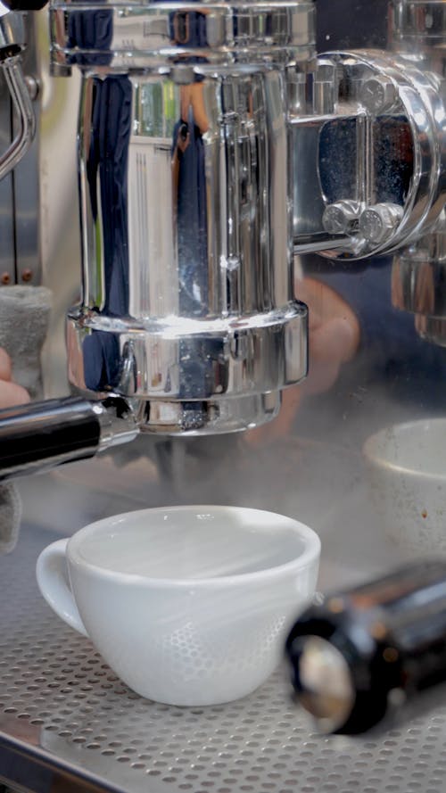 Coffee Dripping From An Espresso Machine's Portafilter