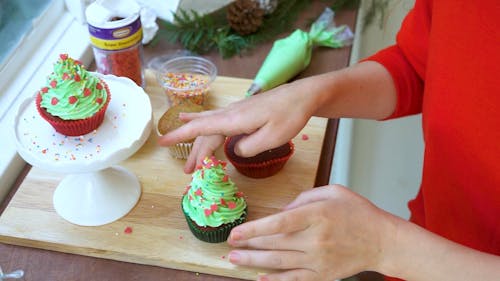 Woman Making Cup Cakes