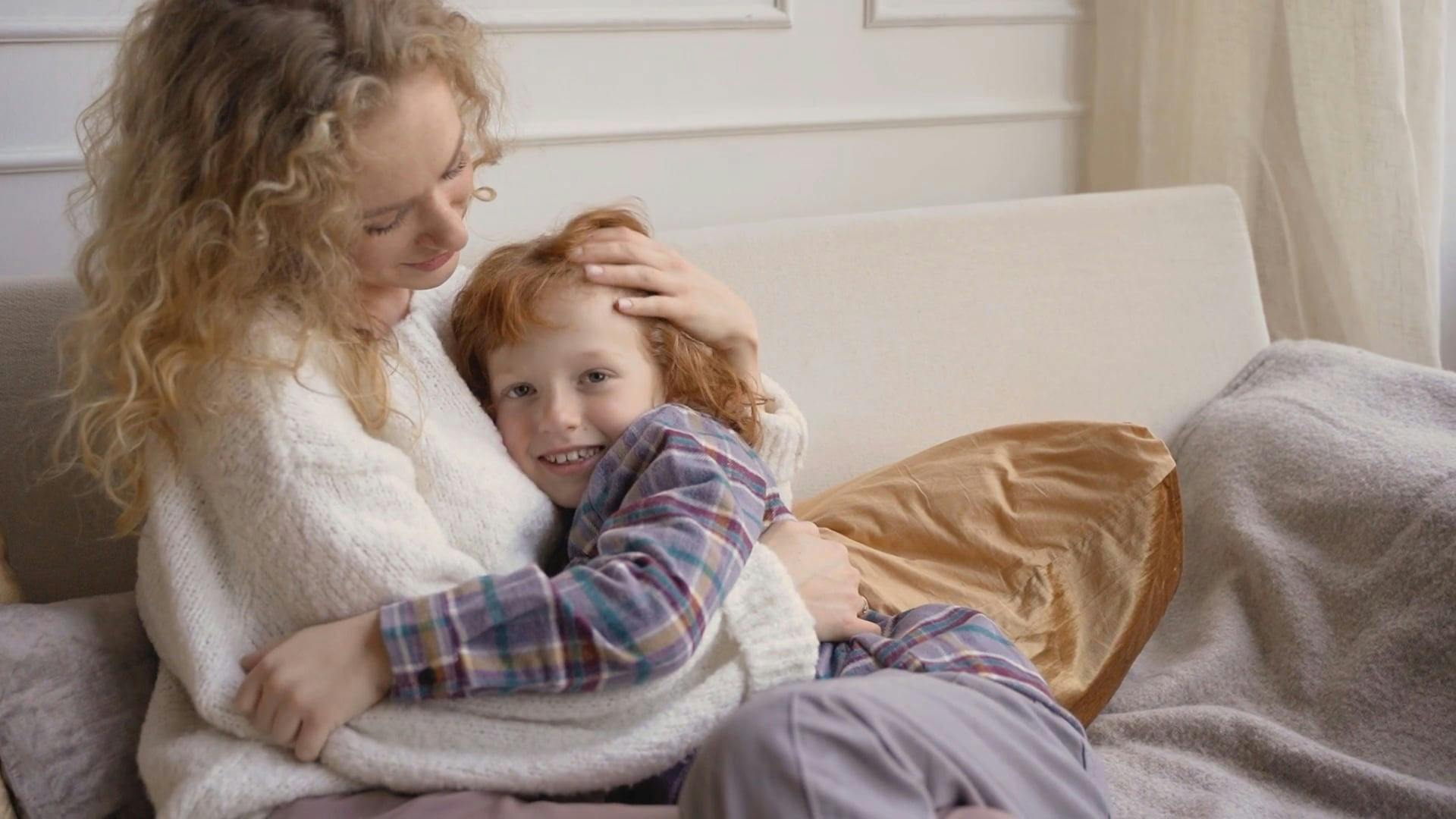 Mom and Son Hugging on the Couch Free Stock Video Footage, Royalty-Free 4K  & HD Video Clip