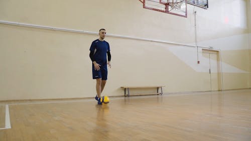 Volleyball Player Serving Ball