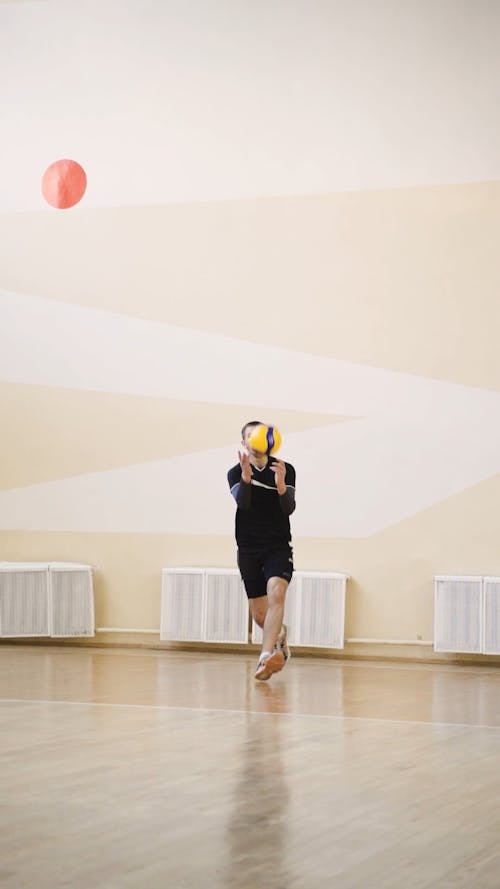 Volleyball  Player Serving Ball