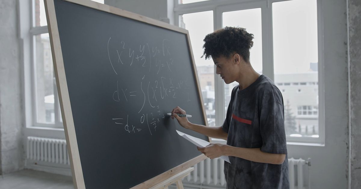 Person Writing Math A Guy Writing Mathematical Equation on a Blackboard Free Stock Video ...