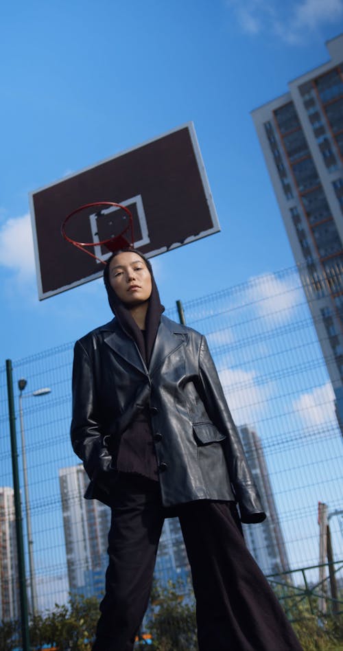 Dutch Angle of a Woman Posing in a Basketball Court