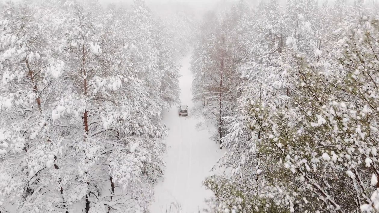 Drone Footage of a Car on Road Covered with Snow Free Stock Video ...