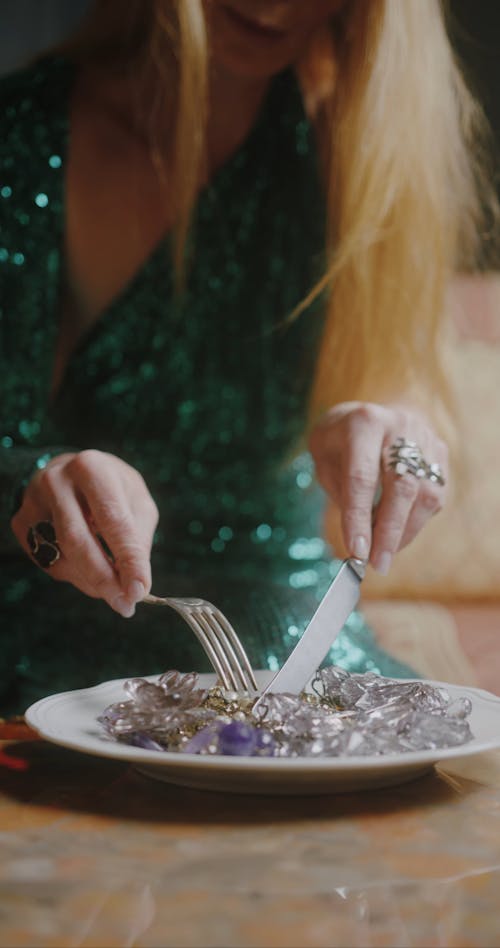 A Beautiful Woman Using Fork and Knife