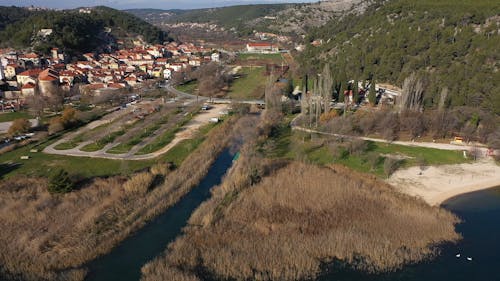 Aerial Footage of a Village near the River