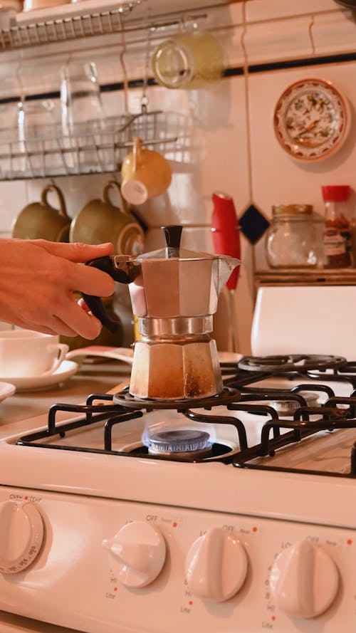 Person Preparing a Coffee