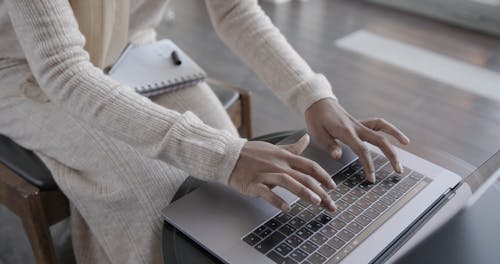 Woman with Hijab Typing on Laptop 