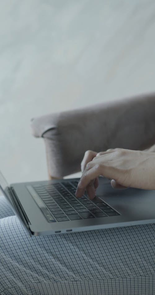 Close Up of Person Typing on Laptop