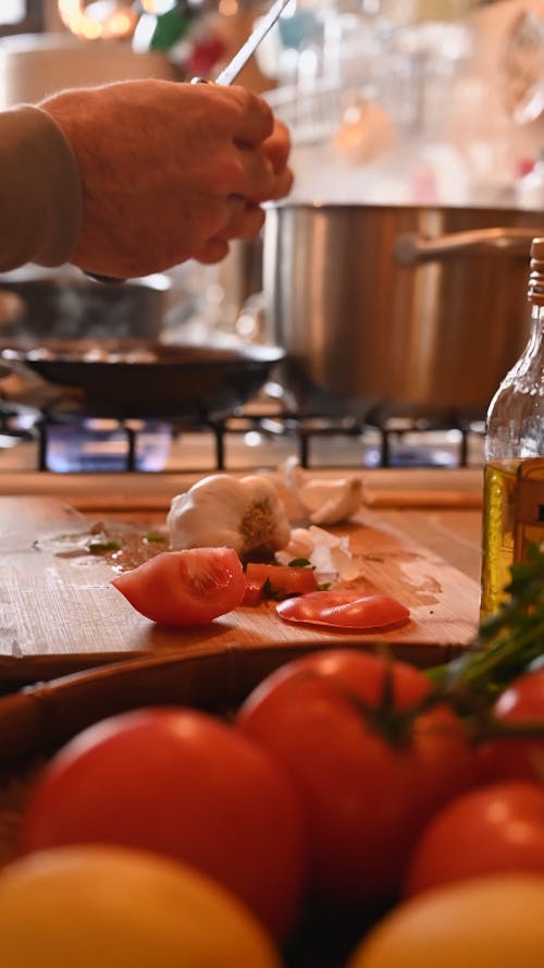 A Person Cooking at the Kitchen