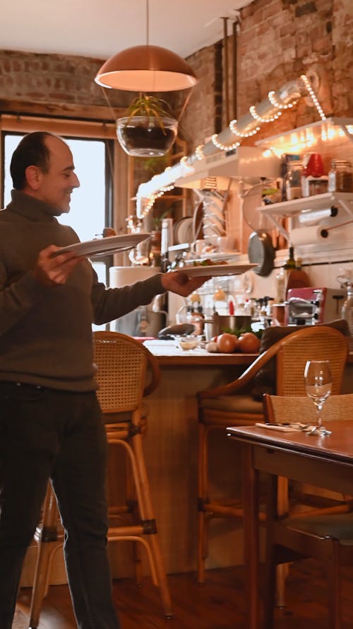 Man Serving Dish to Woman