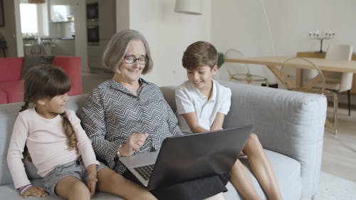 Children and Elderly Woman on a Computer