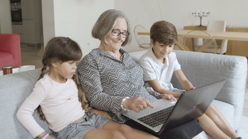 Children and Elderly Woman on Computer